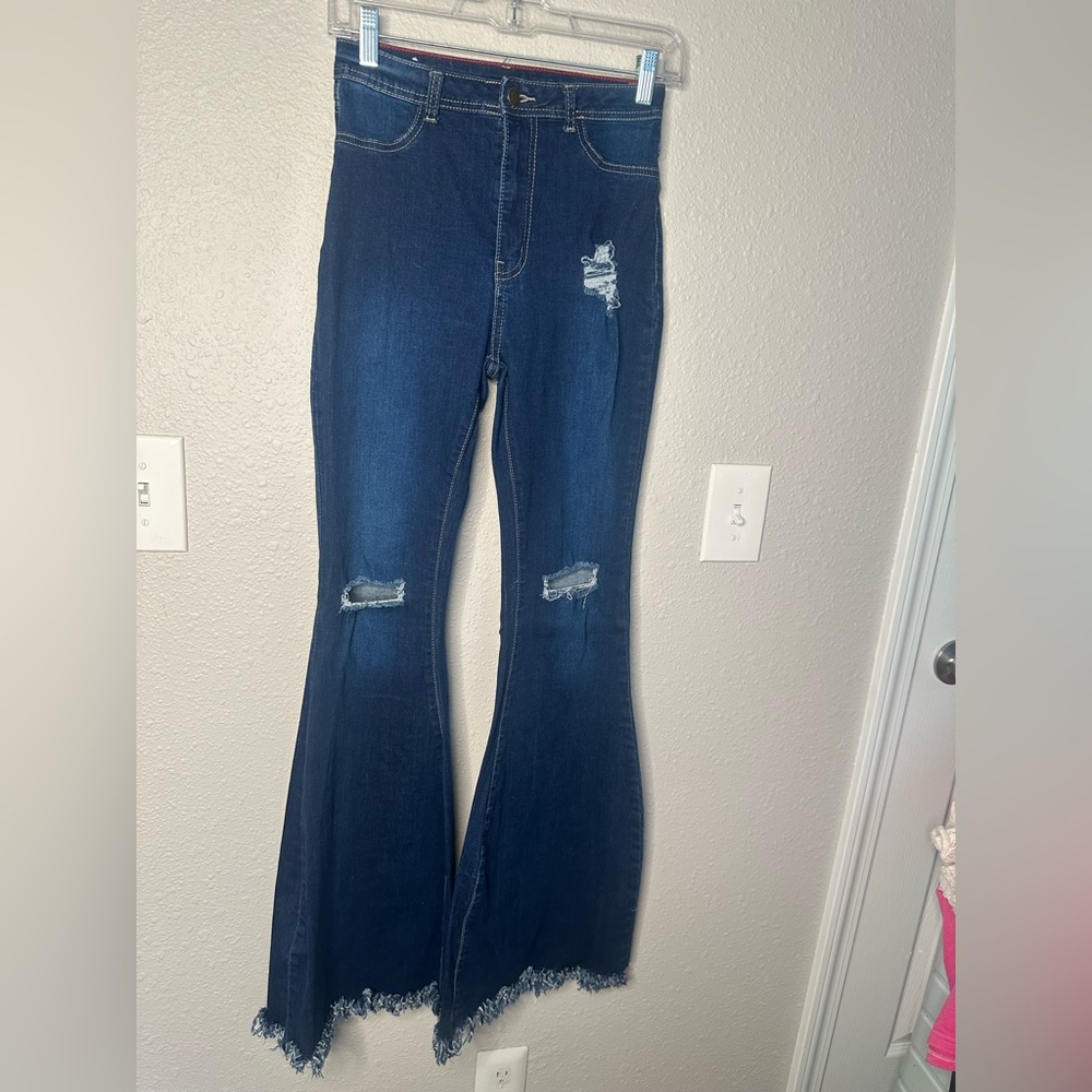 High rise stretchy bell bottoms with raw hem